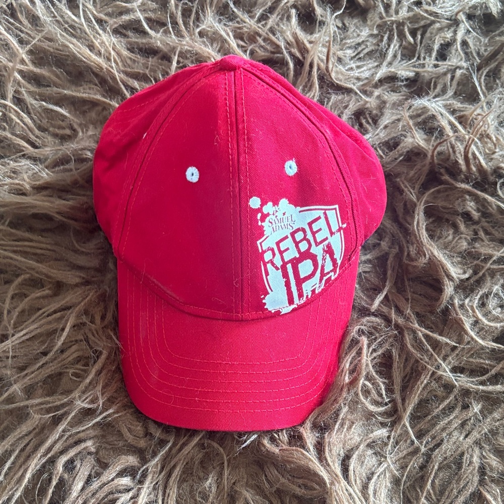 Samuel Adam’s Rebel IPA Red Baseball Cap. Logo on back of cap also.